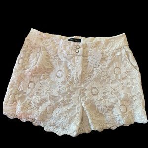 White cream shorts with white sun flower lace details